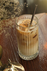 Iced coffee on a cafe table. Closeup selective focus.