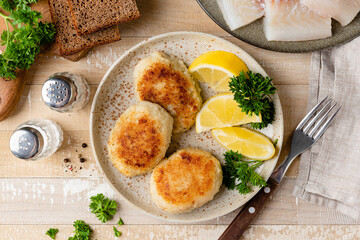 Fish cakes, patties or cutlets on a plate. Cod fish patty fried in breadcrumbs