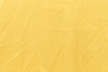 The Clothing Yellow color fabric texture background, top view of cloth textile surface
