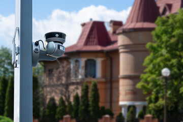 Security camera and private house on the background.