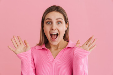 Young enthusiastic girl with wide opened eyes and mouth