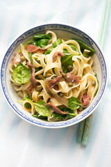 Fresh pasta with spinach, olive oil, anchois and capers