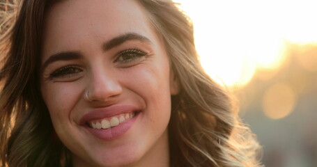 Hispanic latina girl smiling to camera. Portrait of young woman looking to directly to camera happy