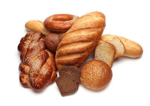 Assortment of baked bread on white background.