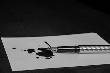 silver fountain pen making splotches of ink