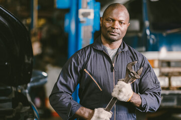 portrait Black African mechanic garage worker check auto service team staff smart standing confident