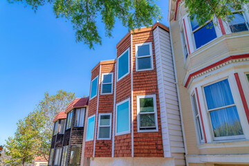 Bay windows of an adjacent houses with wood shingle sidings at San Francisco, California