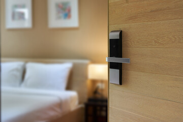  Hotel room , Condominium or apartment doorway with open door in front of blur bedroom background