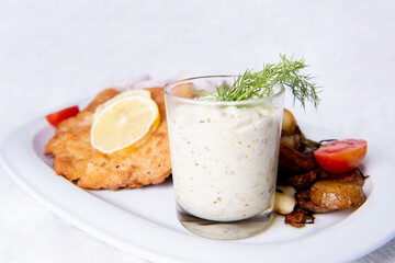 Schnitzel with Soure Cream and Ham cubes & Baked Potatos