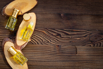 Arabian oud attar oil - perfume in glass bottles. Overhead view