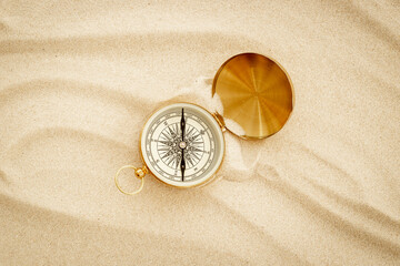 Fototapeta na wymiar Choosing best solution with compass in the sand