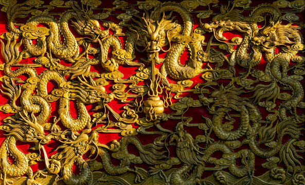 Golden China Dragon Sculpture On Red Background