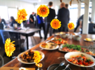 Easter celebration at a restaurant with yellow flower decorations hanging above the food buffet
