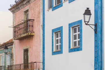 Fototapeta na wymiar Two bright abandoned houses on a European street