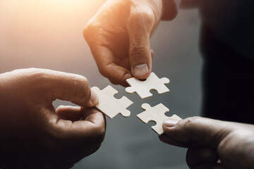 mobile jigsaw puzzle pieces business cooperation concept teamwork and cooperation Businessmen join...