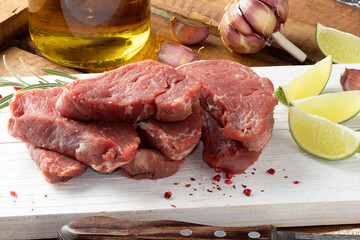 Raw Tenderloin steaks on cutting board. Selective focus.