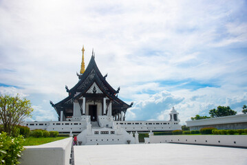 Pagoda Wat Pa Ban Tat temple, Gold temple with beautiful cloudy in Udon Thani Thailand.