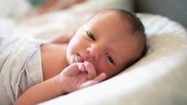 baby newborn. little baby a newborn 1 month of life lies in bed in the maternity hospital. happy family kid dream concept. close-up baby indoors. beautiful lifestyle cute girl lies at home