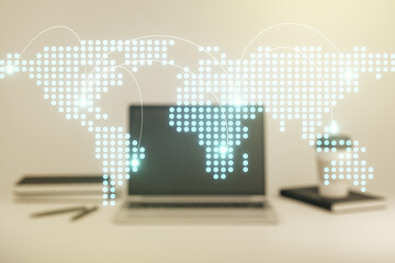 Abstract creative world map with connections on modern laptop background, international trading concept. Multiexposure
