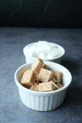 close up of brown sugar cube on table 