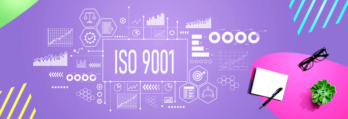 ISO 9001 theme with a notebook and a pen