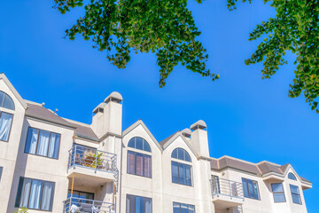 Apartment building with balconies in a low angle view at San Francisco, CA