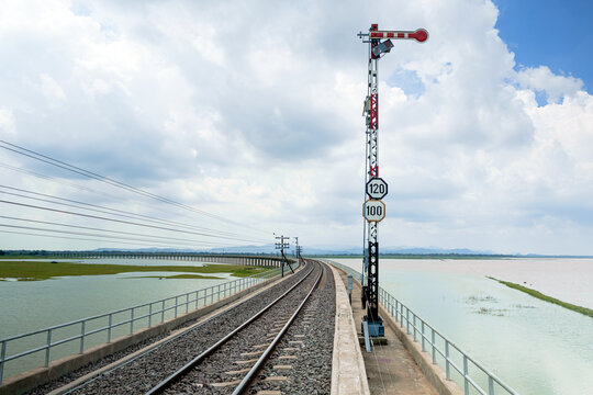 railroad on the lake with beautiful sky at Khok Salung,Lopburi,Thailand,speed limit signpost