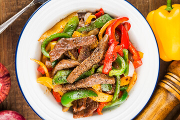 A plate of fried beef cubes with green pepper