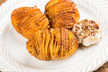 There are delicious baked potatoes on the plate