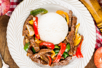 A plate of fried beef rice with green pepper