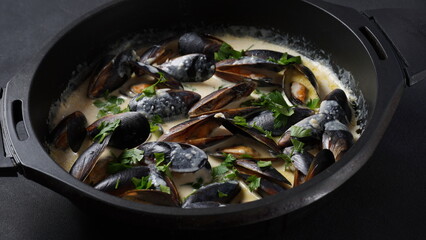 Blue mussels  stewed in cream wine sauce with garlic and herbs. Italian or French traditional food