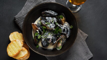 Blue mussels  stewed in cream wine sauce with garlic and herbs. Italian or French traditional food