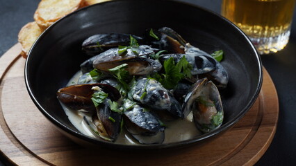 Blue mussels  stewed in cream wine sauce with garlic and herbs. Italian or French traditional food