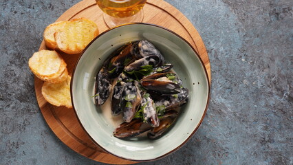 Blue mussels  stewed in cream wine sauce with garlic and herbs. Italian or French traditional food