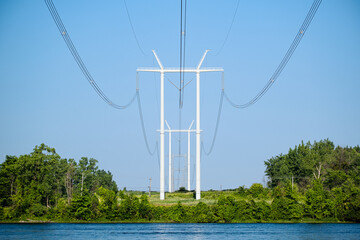 Hydro electric poles with wires crossing a river 