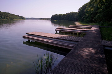 Wooden bridge at the lake in summer