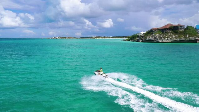 View of jet ski streaming in the open sea, Turks and Caicos Islands. Sapodilla Bay