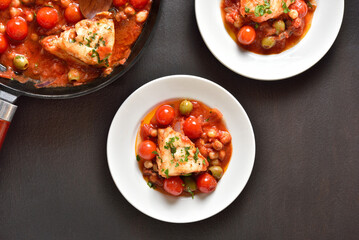 Cod stew with chickpeas, cherry tomatoes and olives