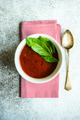 Gazpacho soup served in black bowl