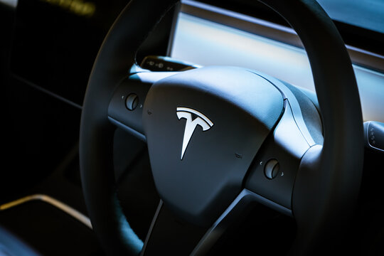 Singapore - July 19, 2022: Tesla logo on a steering wheel.