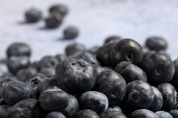 Macro close up of unwashed blueberries.