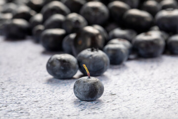 Macro close up of unwashed blueberries.