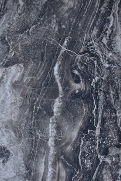 Gray, black marble texture. Marble surface background. Striped marble surface with grains and tracery. © VLADISLAV