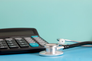 Healthcare cost and medical payment concept , stethoscope with calculator