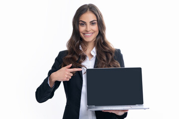Beautiful smiling business woman over grey background using laptop computer. Woman holding laptop with empty mock up screen for copy space.