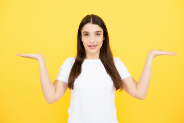 Woman point at copy space, showing copyspace pointing. Promo, girl showing advertisement content gesture, pointing with hand recommend product. Isolated background.