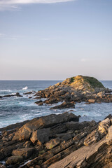 Fototapeta na wymiar Background of a sea breaking in a cliff