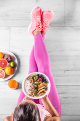 A woman has a healthy breakfast after morning exercise - Top of view - 522075750