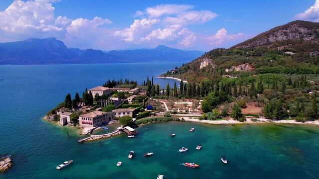 Italy Garda Lake Punta San Vigilio drone 4K aerial view of most romantic place in northern Italy. Scenic Lago di Garda luxury travel destination with cypress trees and historic villa video