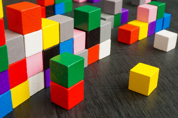 Multi-colored cubes on the surface as a symbol of complexity, diversity and integration.